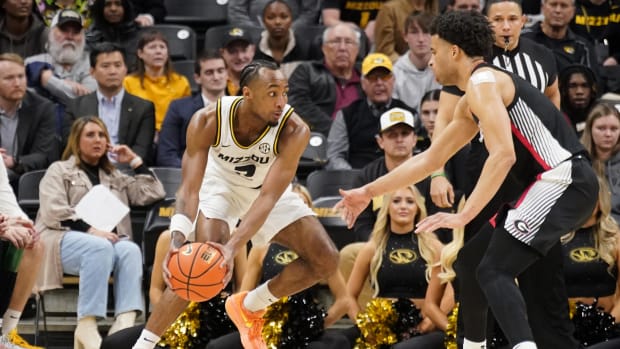 Jan 6, 2024; Columbia, Missouri, USA; Missouri Tigers guard Tamar Bates (2) dribbles the ball as Georgia Bulldogs guard Jabri Abdur-Rahim (1) defends during the second half at Mizzou Arena. 